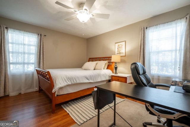 bedroom featuring light wood-type flooring and ceiling fan