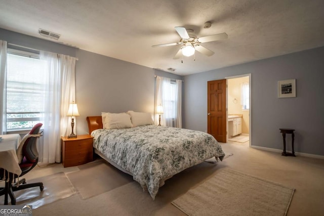 bedroom with multiple windows, light colored carpet, visible vents, and baseboards