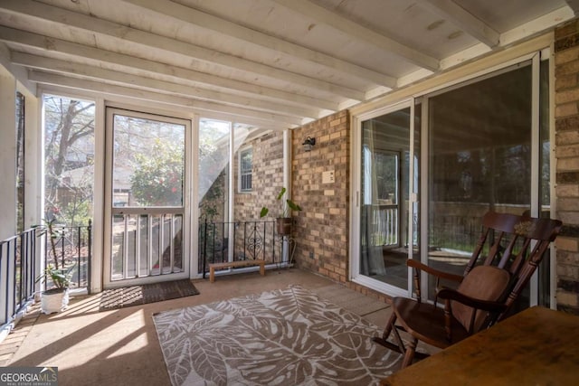 sunroom with beam ceiling