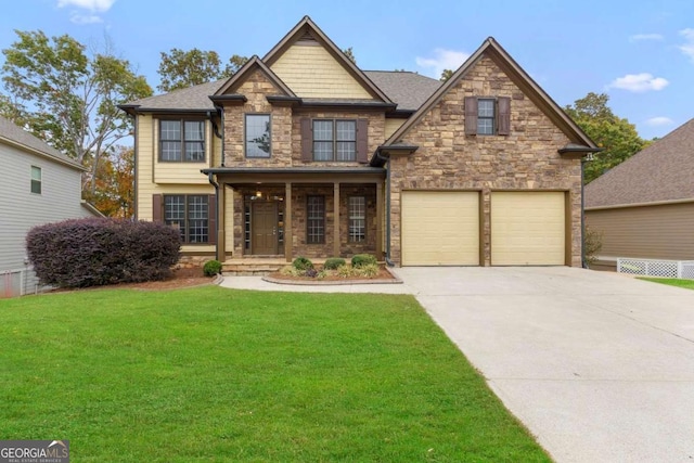 craftsman-style home featuring driveway, a front lawn, and stone siding