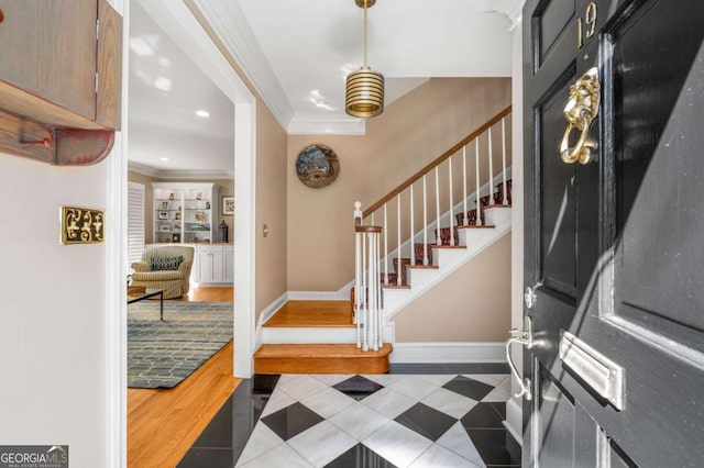 foyer entrance with baseboards, stairway, ornamental molding, tile patterned floors, and recessed lighting