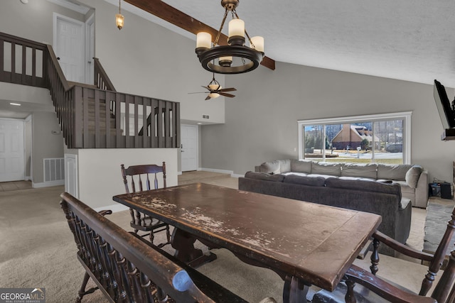 carpeted dining area with visible vents, stairway, high vaulted ceiling, and baseboards