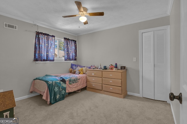 carpeted bedroom with visible vents, baseboards, a textured ceiling, and crown molding