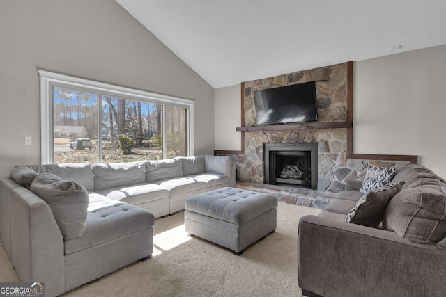 carpeted living area with high vaulted ceiling and a fireplace