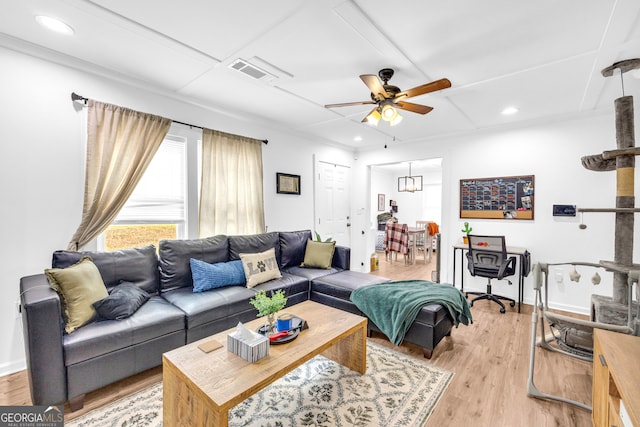 living area featuring light wood-style floors, ceiling fan, visible vents, and recessed lighting