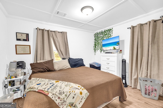 bedroom featuring light wood-style flooring and visible vents