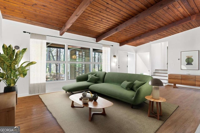 living area with wood ceiling, vaulted ceiling with beams, stairway, and wood finished floors