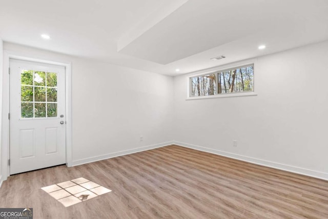 interior space featuring recessed lighting, visible vents, baseboards, and wood finished floors