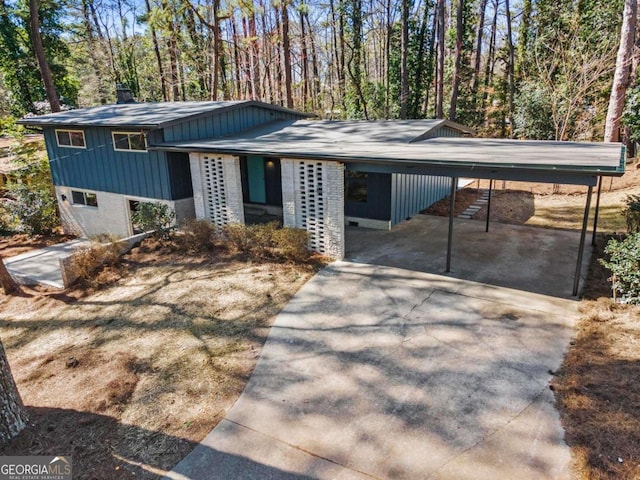 split level home with a carport and concrete driveway