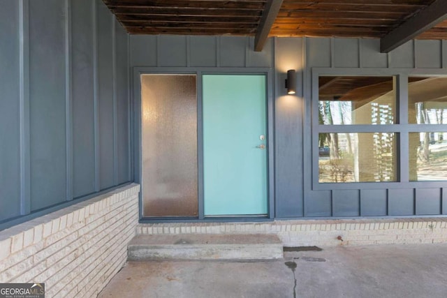 property entrance with board and batten siding