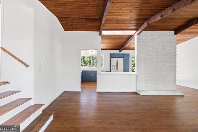 interior space featuring vaulted ceiling with beams, wooden ceiling, dark wood finished floors, and stairway