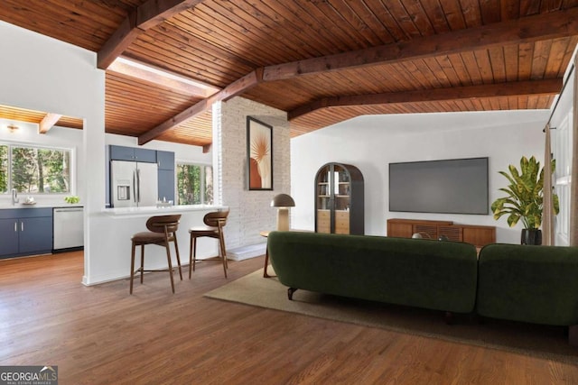 living area with wood ceiling, vaulted ceiling with beams, and wood finished floors