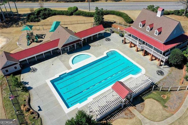 community pool with a patio area