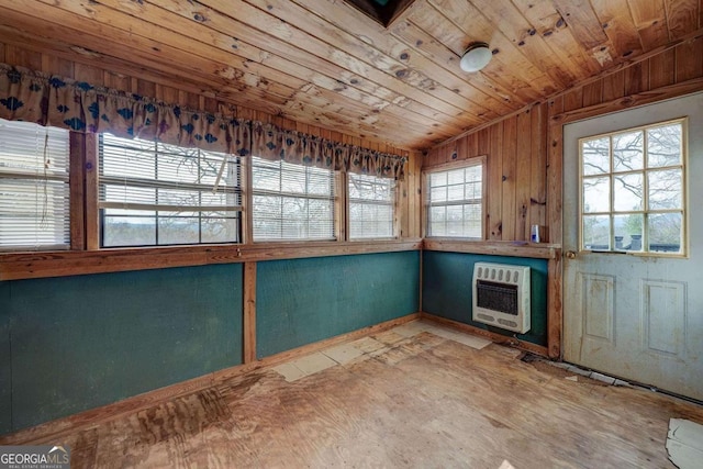 interior space with heating unit and wood ceiling