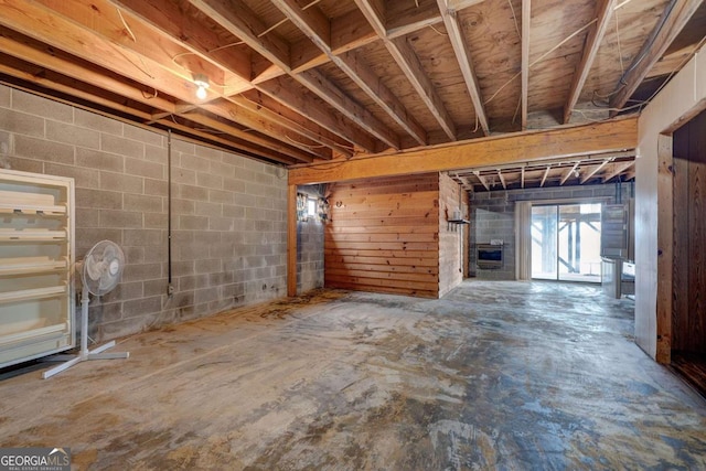 unfurnished living room with concrete floors