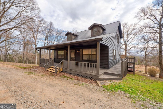 view of front of home with covered porch and metal roof