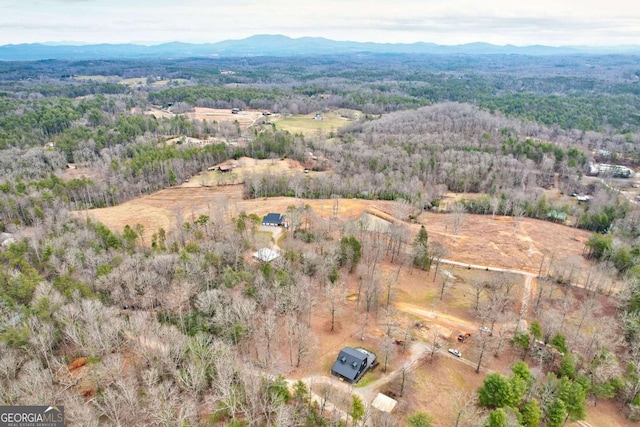 aerial view with a forest view and a mountain view