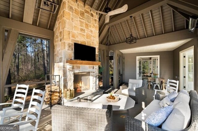 view of patio featuring an outdoor living space with a fireplace