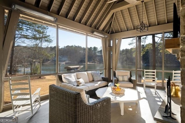 sunroom with a water view, wood ceiling, and vaulted ceiling with beams