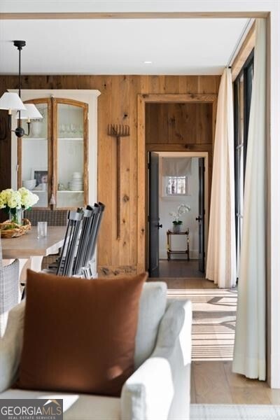 living area with wood walls