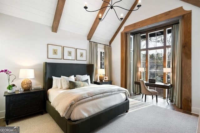 bedroom featuring an inviting chandelier, vaulted ceiling with beams, and access to outside