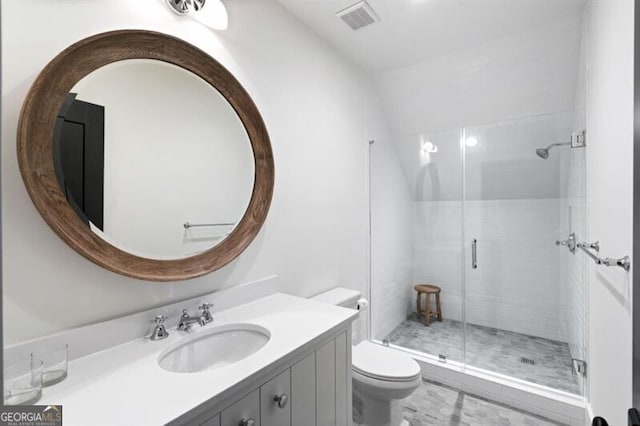 full bathroom with visible vents, toilet, a stall shower, and vanity