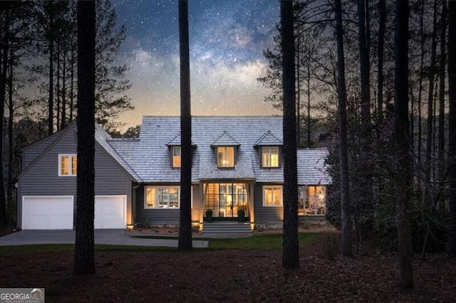 view of front of home featuring concrete driveway and a garage