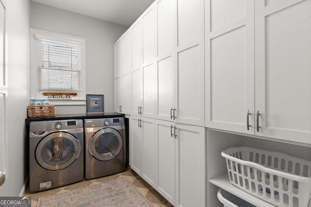 laundry room featuring cabinet space and washing machine and dryer