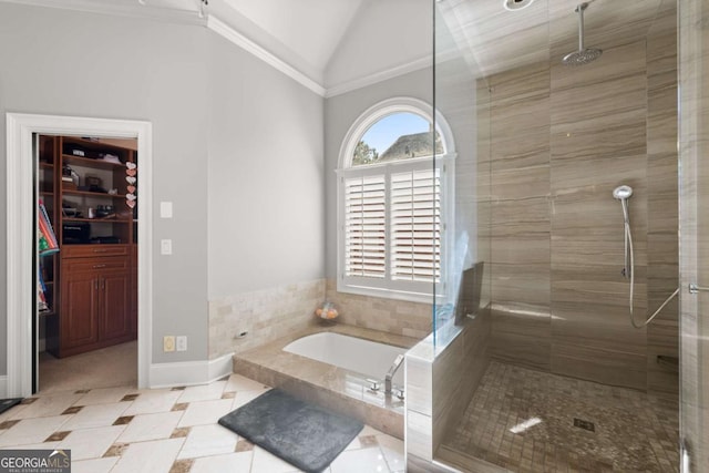 full bath with a stall shower, tile patterned flooring, vaulted ceiling, a walk in closet, and a bath