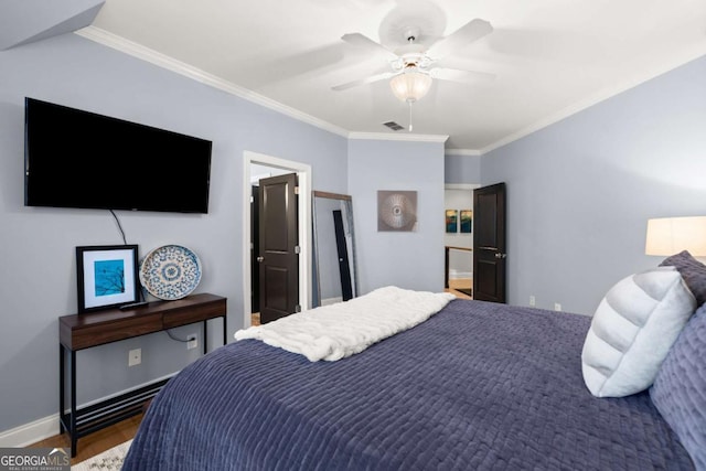 bedroom with visible vents, wood finished floors, crown molding, baseboards, and ceiling fan