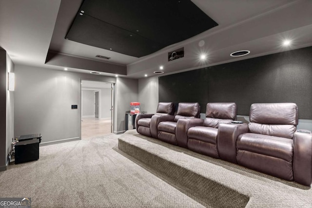 home theater room with visible vents, recessed lighting, a raised ceiling, and carpet