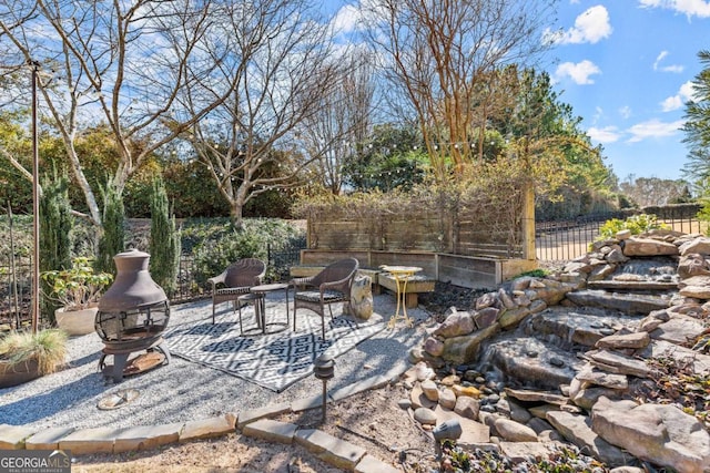 view of patio featuring fence