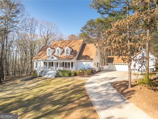 cape cod house with a porch and a front yard