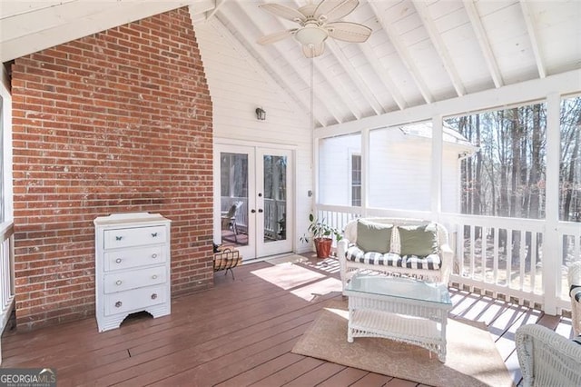 sunroom featuring french doors, vaulted ceiling with beams, and ceiling fan