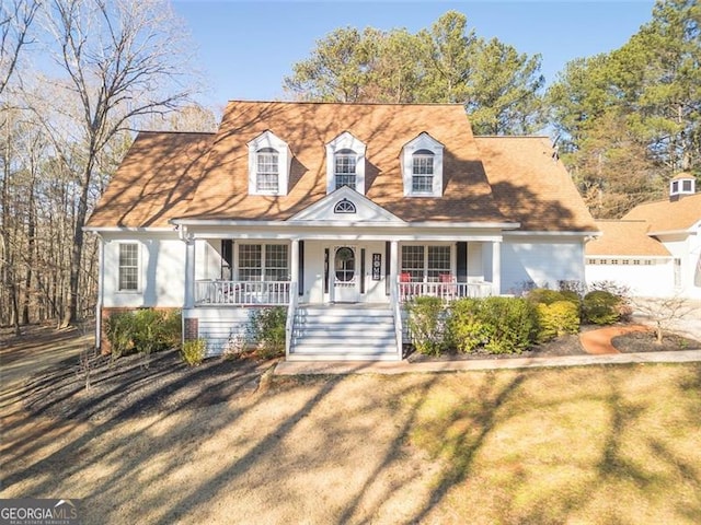 new england style home with a porch