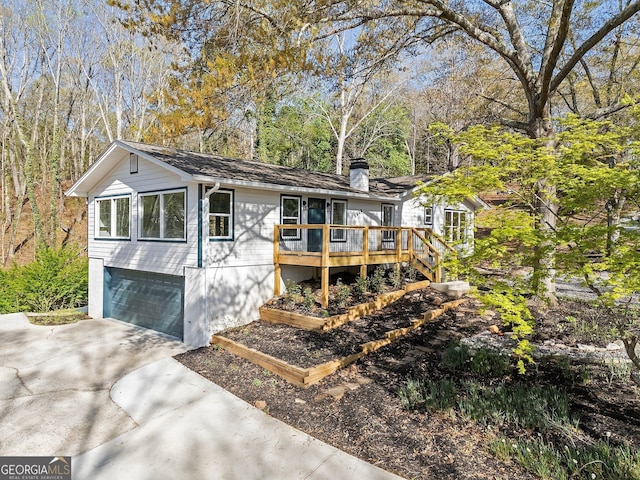 5985 Lakeside Ct, Gainesville, GA 30506 - ranch-style home with driveway, a chimney, a garage, and a wooden deck