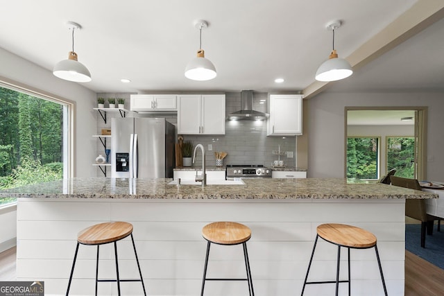 5985 Lakeside Ct, Gainesville, GA 30506 - kitchen featuring wall chimney range hood, stainless steel appliances, a sink, plenty of natural light, and recessed lighting