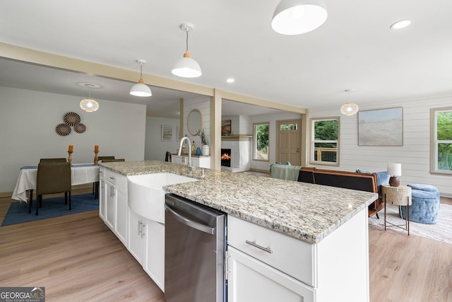 5985 Lakeside Ct, Gainesville, GA 30506 - kitchen featuring stainless steel dishwasher, light wood-style flooring, a large fireplace, white cabinets, and recessed lighting