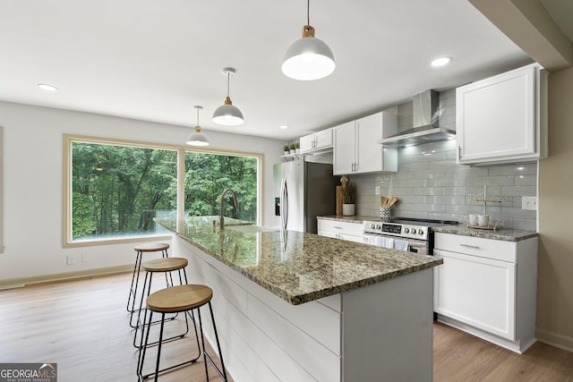 5985 Lakeside Ct, Gainesville, GA 30506 - kitchen with wall chimney exhaust hood, appliances with stainless steel finishes, a sink, white cabinets, and recessed lighting