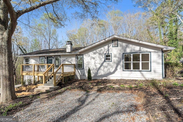 5985 Lakeside Ct, Gainesville, GA 30506 - rear view of house featuring a chimney and a wooden deck