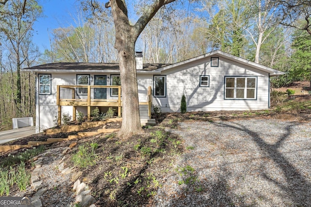5985 Lakeside Ct, Gainesville, GA 30506 - rear view of house featuring a chimney and a wooden deck