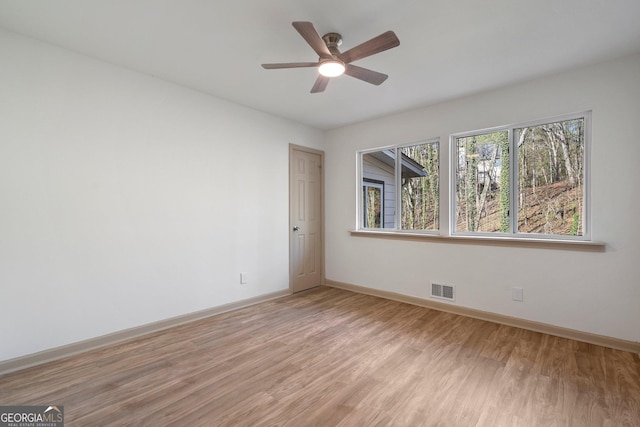 5985 Lakeside Ct, Gainesville, GA 30506 - unfurnished room with light wood-type flooring, baseboards, and ceiling fan