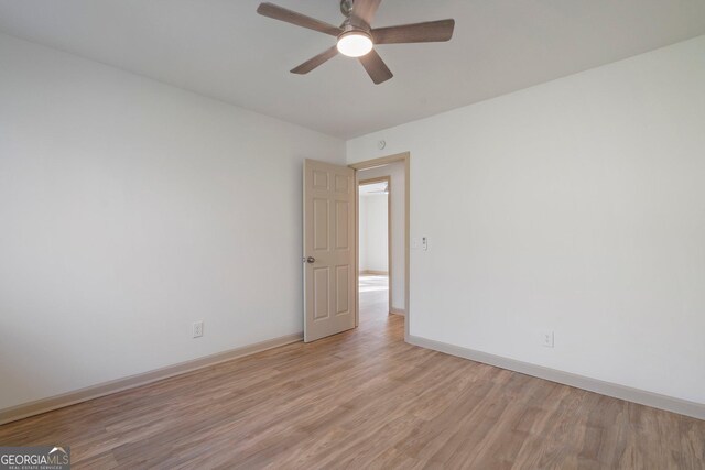 5985 Lakeside Ct, Gainesville, GA 30506 - spare room featuring light wood-style floors, ceiling fan, and baseboards