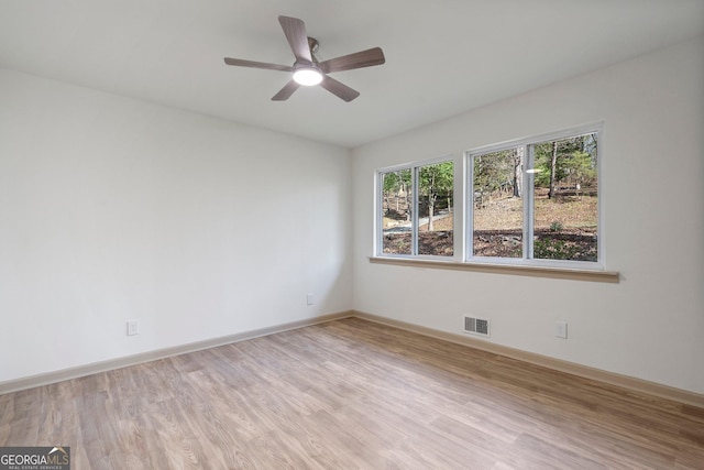 5985 Lakeside Ct, Gainesville, GA 30506 - spare room featuring light wood-style flooring, a ceiling fan, and baseboards