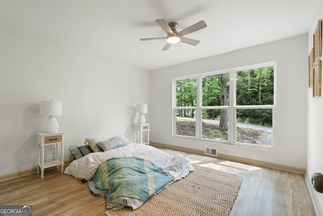 5985 Lakeside Ct, Gainesville, GA 30506 - bedroom with light wood-type flooring, baseboards, and a ceiling fan
