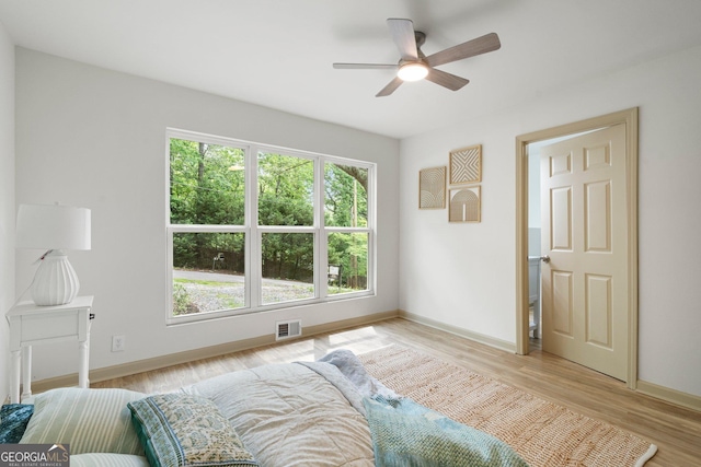 5985 Lakeside Ct, Gainesville, GA 30506 - bedroom featuring baseboards, light wood finished floors, and a ceiling fan