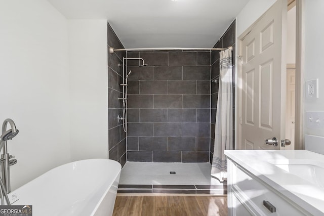 5985 Lakeside Ct, Gainesville, GA 30506 - bathroom with tiled shower, a freestanding tub, vanity, and wood finished floors
