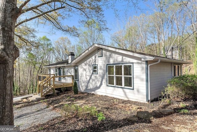 5985 Lakeside Ct, Gainesville, GA 30506 - view of home's exterior featuring a wooden deck, a chimney, and stairway