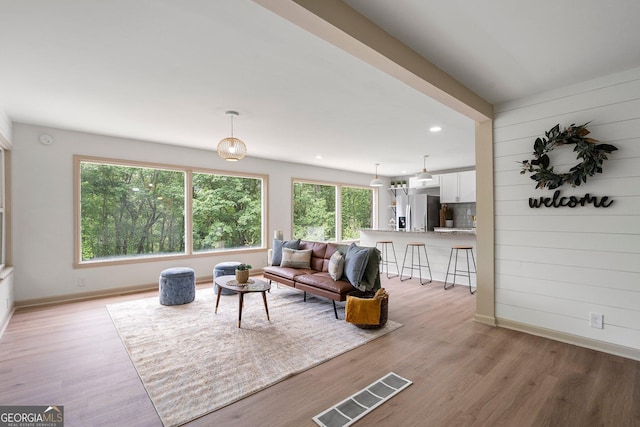 5985 Lakeside Ct, Gainesville, GA 30506 - living room featuring plenty of natural light, baseboards, light wood finished floors, and recessed lighting