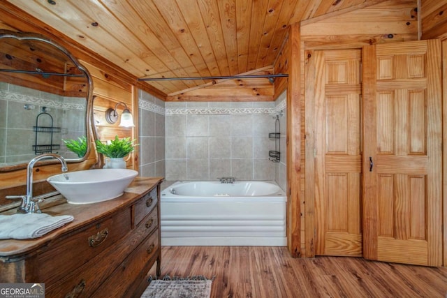 bathroom with lofted ceiling, wooden ceiling, wood finished floors, vanity, and shower / washtub combination